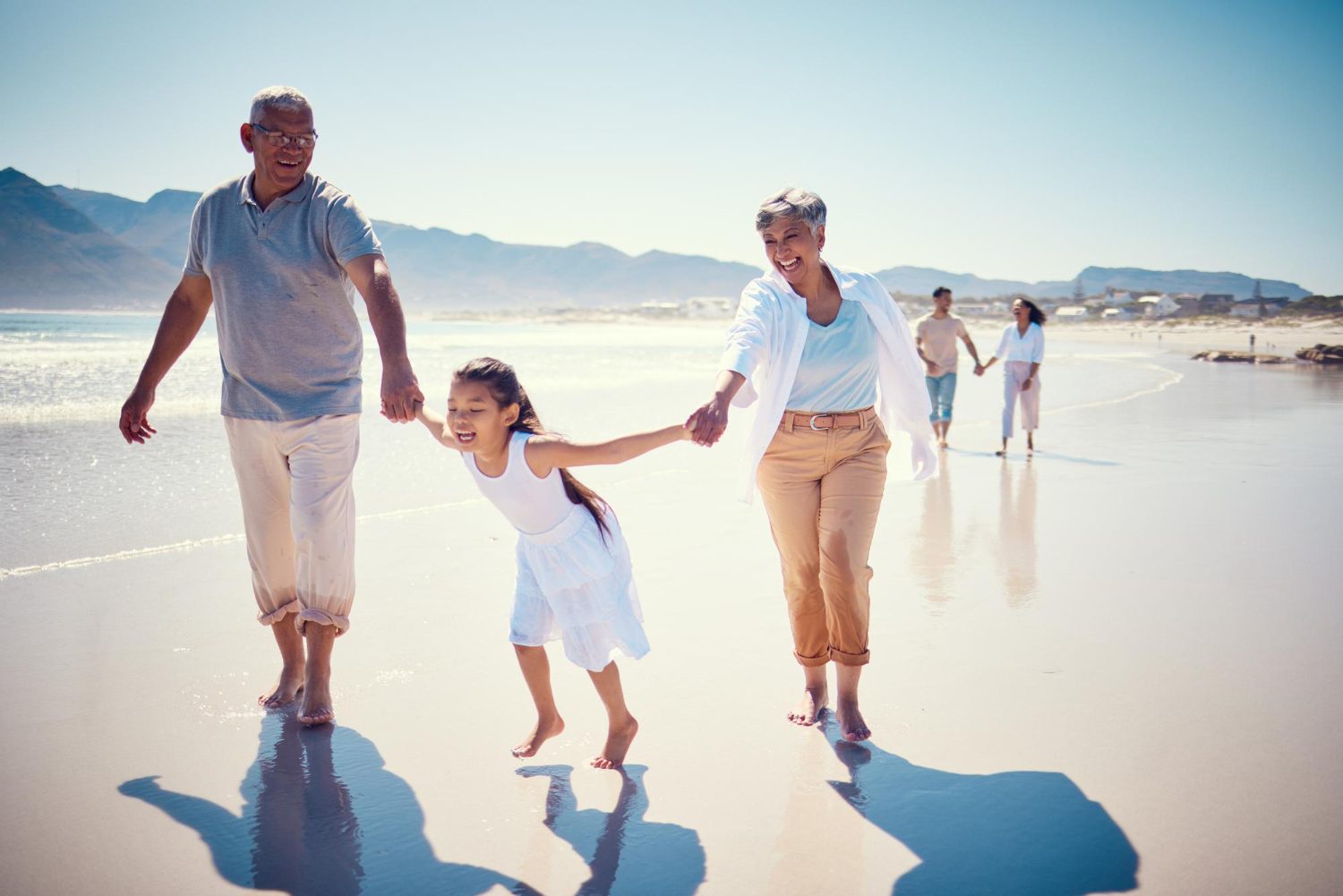 family walking at the beach